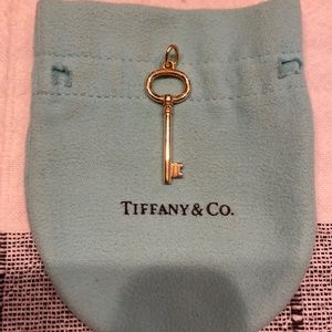 Authentic Tiffany & Co. 18K yellow gold key charm.